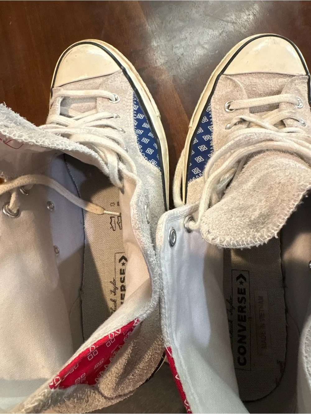 Converse Chuck Taylor’s White High Top Sneakers with Red and Blue Accents